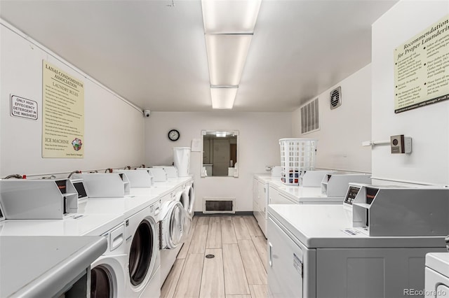 800 N Washington St Unit 804, Denver, CO 80203 - shared laundry with separate washer and dryer, wood tiled floors, and baseboards