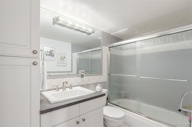 800 N Washington St Unit 804, Denver, CO 80203 - full bath with decorative backsplash, vanity, toilet, enclosed tub / shower combo, and tile walls