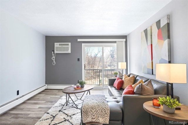 living area featuring a wall unit AC, wood finished floors, baseboard heating, and a baseboard radiator