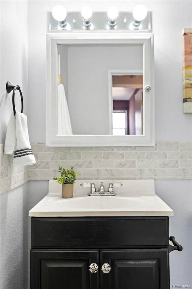 bathroom featuring backsplash and vanity