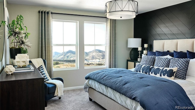 carpeted bedroom with a mountain view