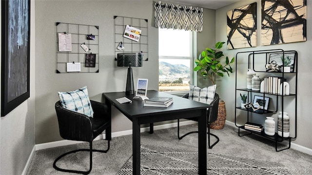 office with carpet, baseboards, and a mountain view