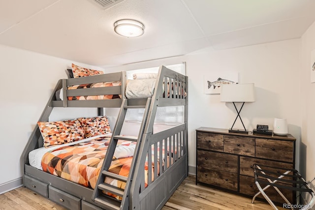 1271 Uinta St, Denver, CO 80220 - bedroom featuring wood finished floors and baseboards