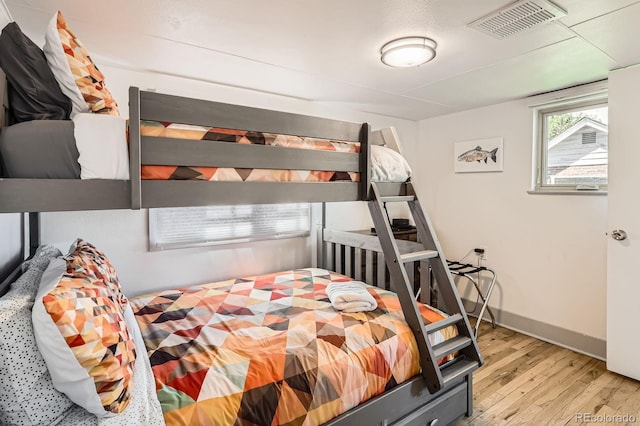 1271 Uinta St, Denver, CO 80220 - bedroom featuring wood finished floors and baseboards