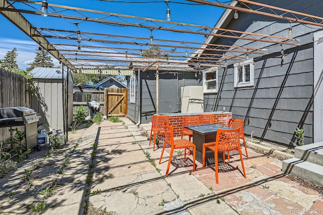 1271 Uinta St, Denver, CO 80220 - view of patio featuring a gate and grilling area