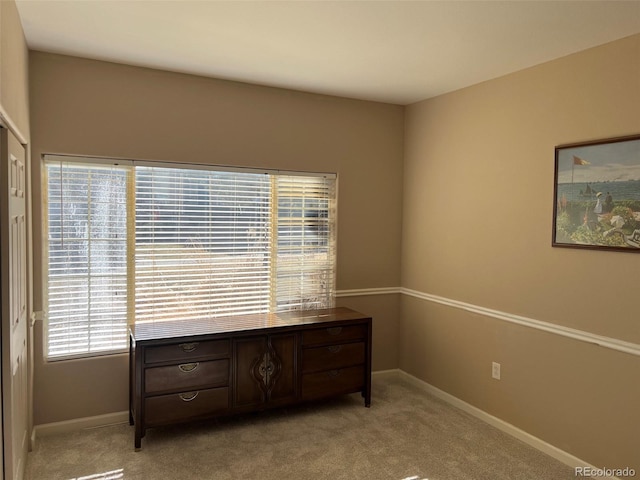 bedroom with carpet flooring and baseboards