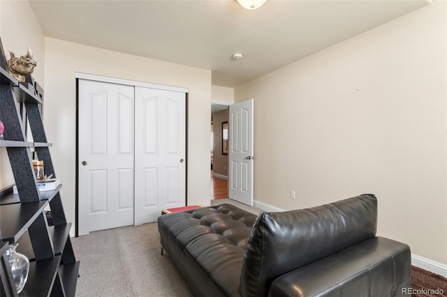 interior space featuring carpet and baseboards