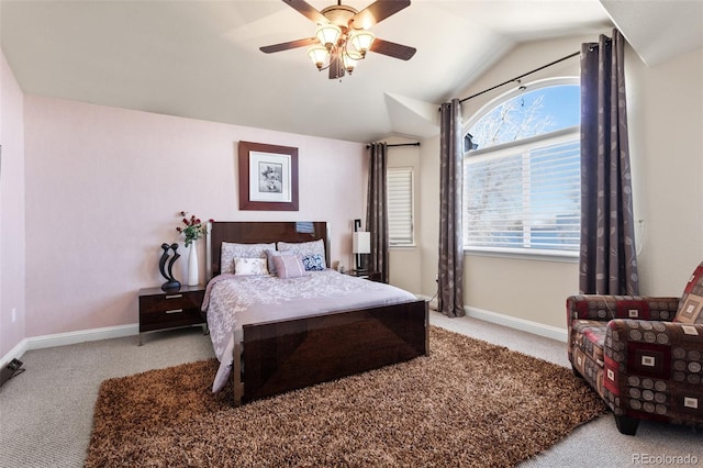 carpeted bedroom with lofted ceiling, ceiling fan, and baseboards