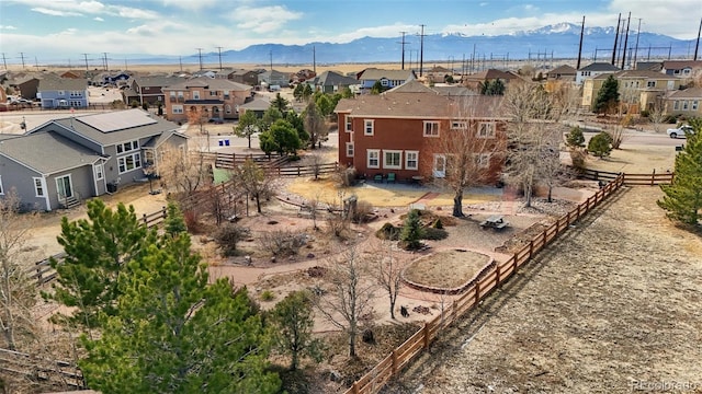 birds eye view of property featuring a mountain view and a residential view