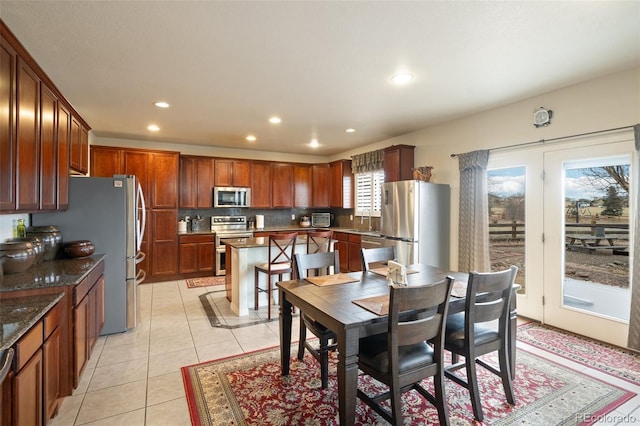 dining area with recessed lighting and light tile patterned floors