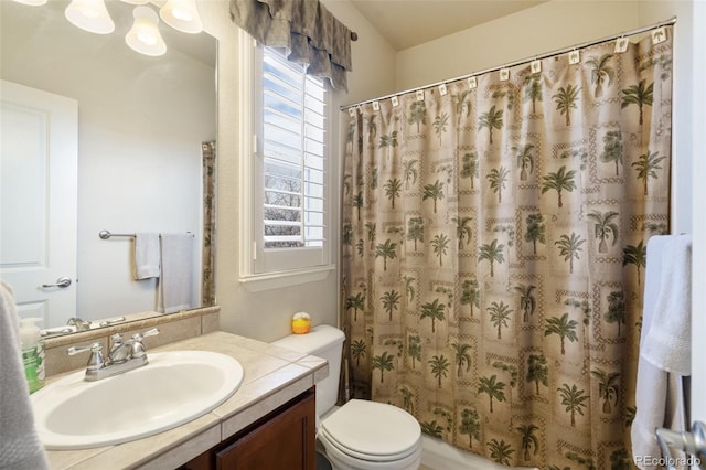 bathroom featuring vanity, toilet, and a shower with curtain