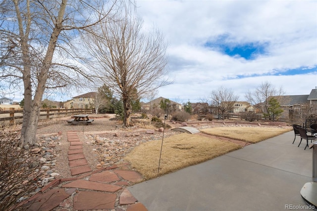 view of yard with a patio area and fence