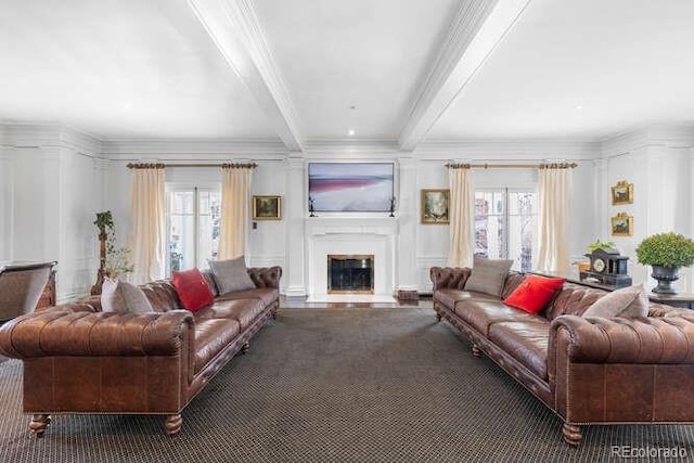 living room featuring crown molding, beam ceiling, and a wealth of natural light