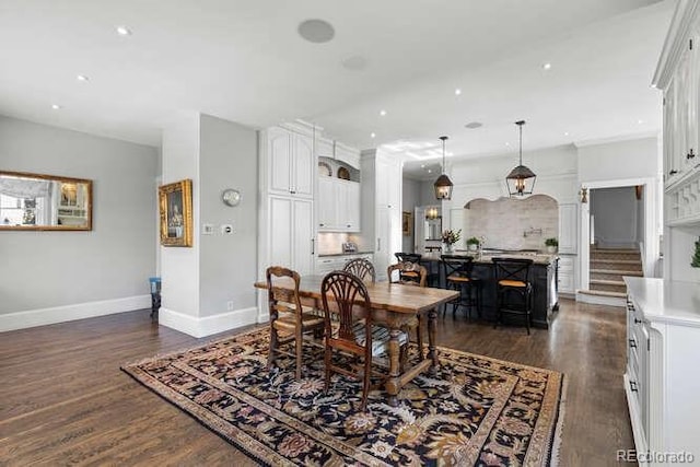 dining area with dark hardwood / wood-style flooring