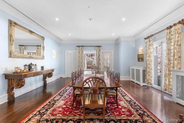 dining area with crown molding and dark hardwood / wood-style floors