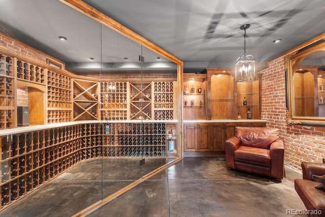 wine cellar featuring brick wall