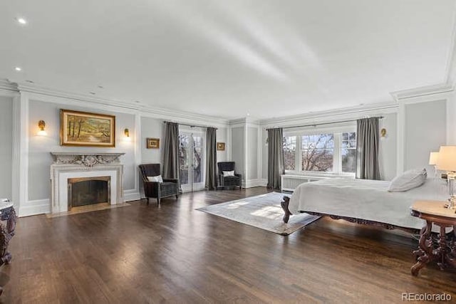 bedroom featuring crown molding and dark wood-type flooring