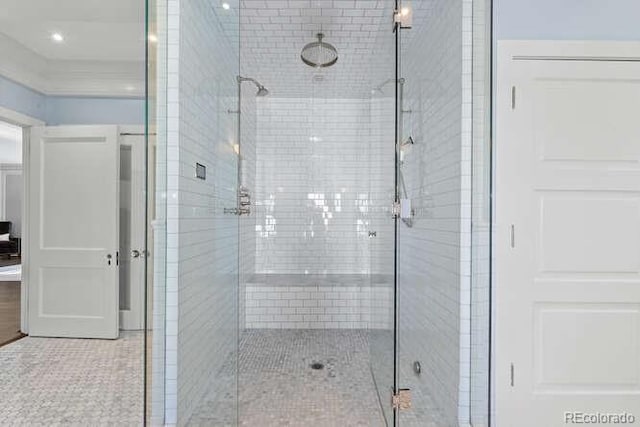 bathroom featuring walk in shower and tile patterned flooring