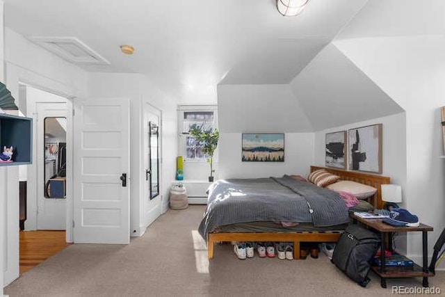 bedroom featuring light carpet