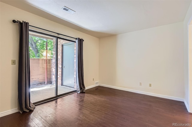 2223 S Buckley Rd Unit 102, Aurora, CO 80013 - unfurnished room featuring dark wood-style floors and baseboards