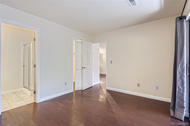 2223 S Buckley Rd Unit 102, Aurora, CO 80013 - spare room featuring wood finished floors and baseboards