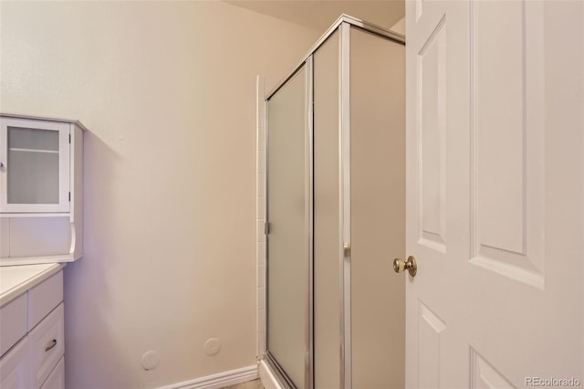 2223 S Buckley Rd Unit 102, Aurora, CO 80013 - full bathroom featuring a shower stall and vanity