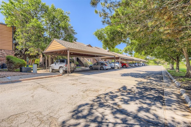 2223 S Buckley Rd Unit 102, Aurora, CO 80013 - covered parking lot featuring stairs