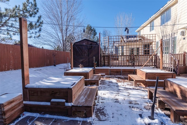 snow covered patio with a jacuzzi