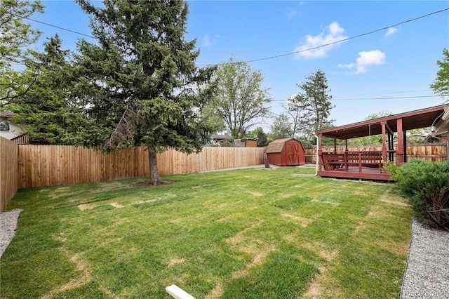 view of yard featuring a shed and a deck