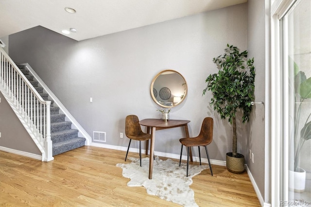 3030 Wyandot St Unit 4, Denver, CO 80211 - sitting room featuring stairs, wood finished floors, and baseboards