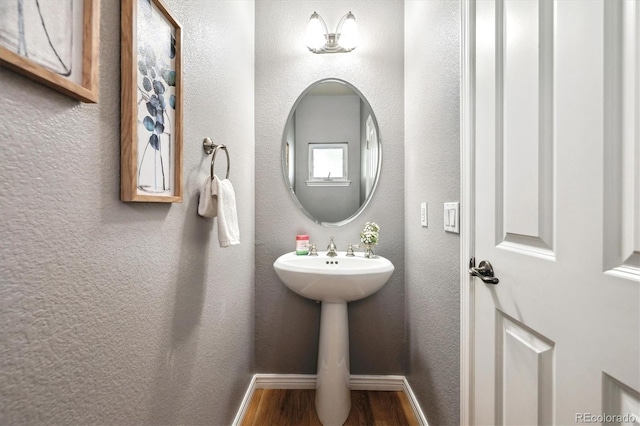3030 Wyandot St Unit 4, Denver, CO 80211 - bathroom with wood finished floors, baseboards, and a sink