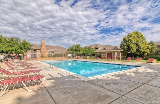 7440 S Blackhawk St Unit 9-108, Englewood, CO 80112 - community pool featuring a patio