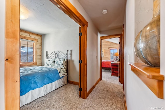 bedroom featuring baseboards and carpet floors
