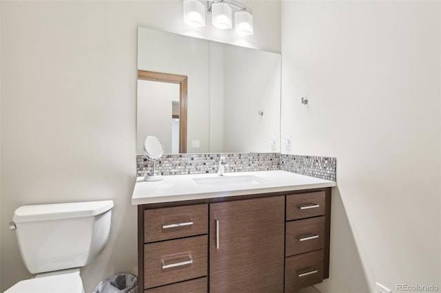 784 Grand Horizon Vw, Manitou Springs, CO 80829 - bathroom with vanity, toilet, and decorative backsplash