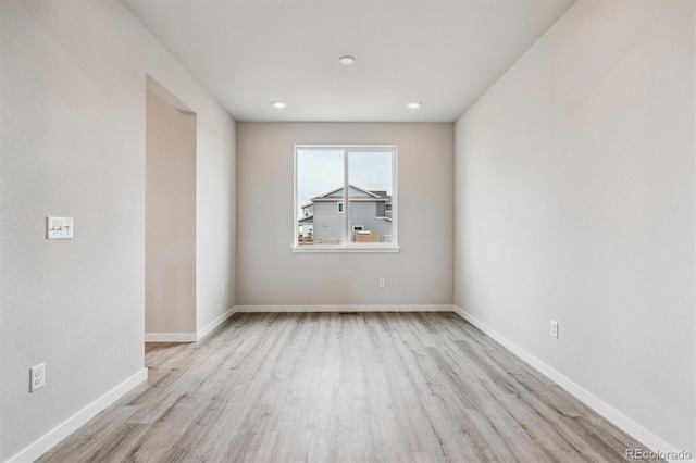 unfurnished room featuring light hardwood / wood-style flooring