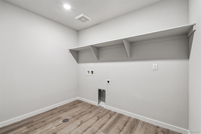 clothes washing area featuring washer hookup, hookup for an electric dryer, and light hardwood / wood-style flooring