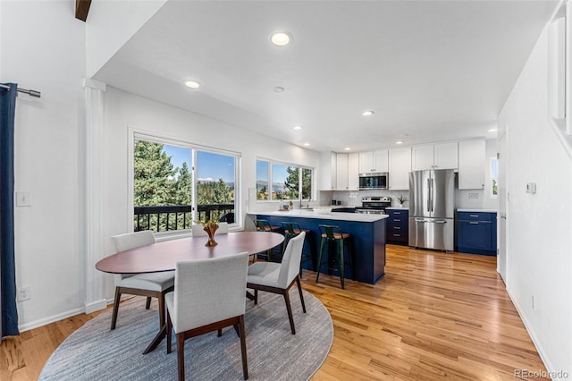 251 Ridgeview Ln, Boulder, CO 80302 - dining area featuring plenty of natural light, light wood-style flooring, and recessed lighting