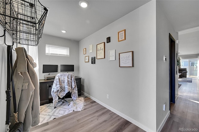 home office featuring plenty of natural light and hardwood / wood-style floors