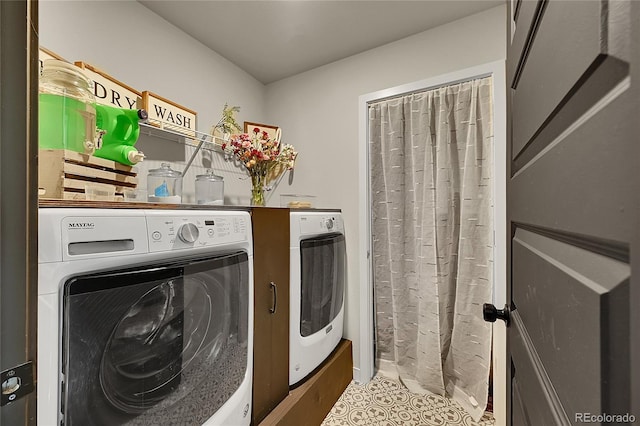 washroom with independent washer and dryer and tile patterned floors