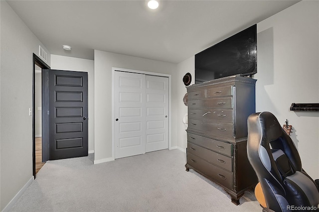 carpeted bedroom featuring a closet