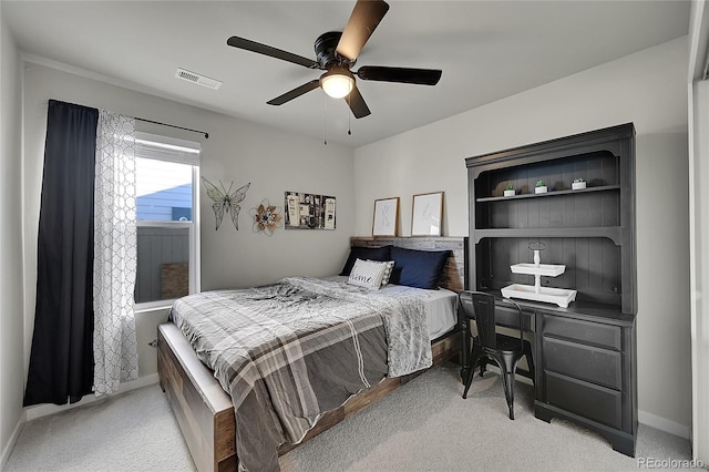 bedroom featuring light carpet and ceiling fan