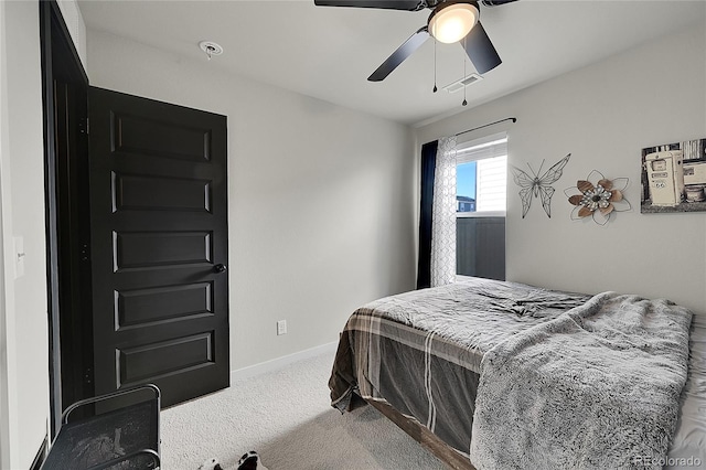 carpeted bedroom featuring ceiling fan