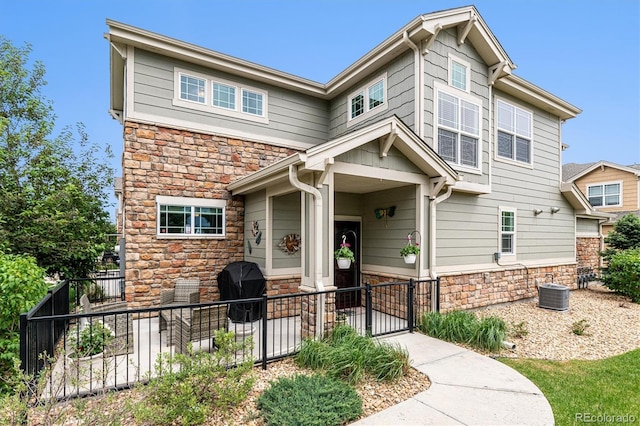 craftsman-style home with central AC unit