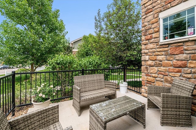 view of patio / terrace featuring an outdoor living space and a balcony