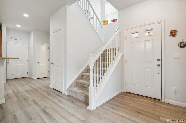 foyer entrance with light hardwood / wood-style flooring