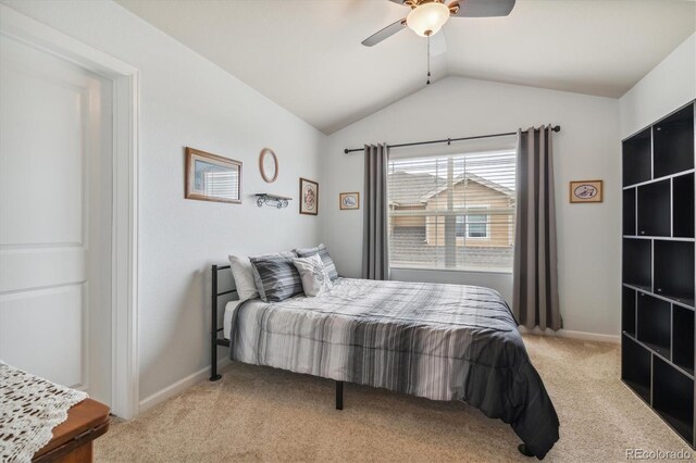 bedroom with ceiling fan, lofted ceiling, and light colored carpet