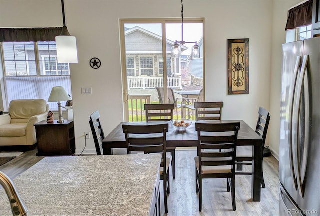 22345 E Bailey Pl, Aurora, CO 80016 - dining space with light wood finished floors, baseboards, and ceiling fan