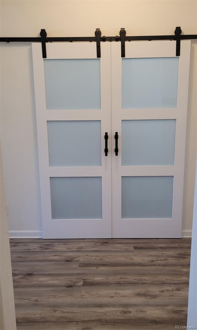 22345 E Bailey Pl, Aurora, CO 80016 - interior space with a barn door and wood finished floors