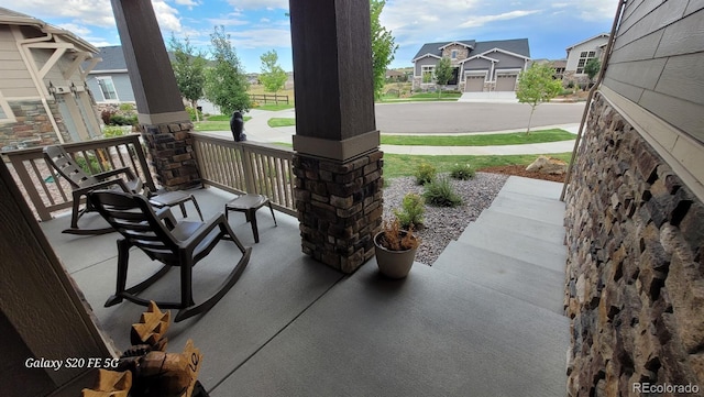 22345 E Bailey Pl, Aurora, CO 80016 - view of patio featuring a residential view and covered porch