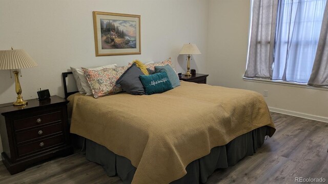22345 E Bailey Pl, Aurora, CO 80016 - bedroom with baseboards and wood finished floors